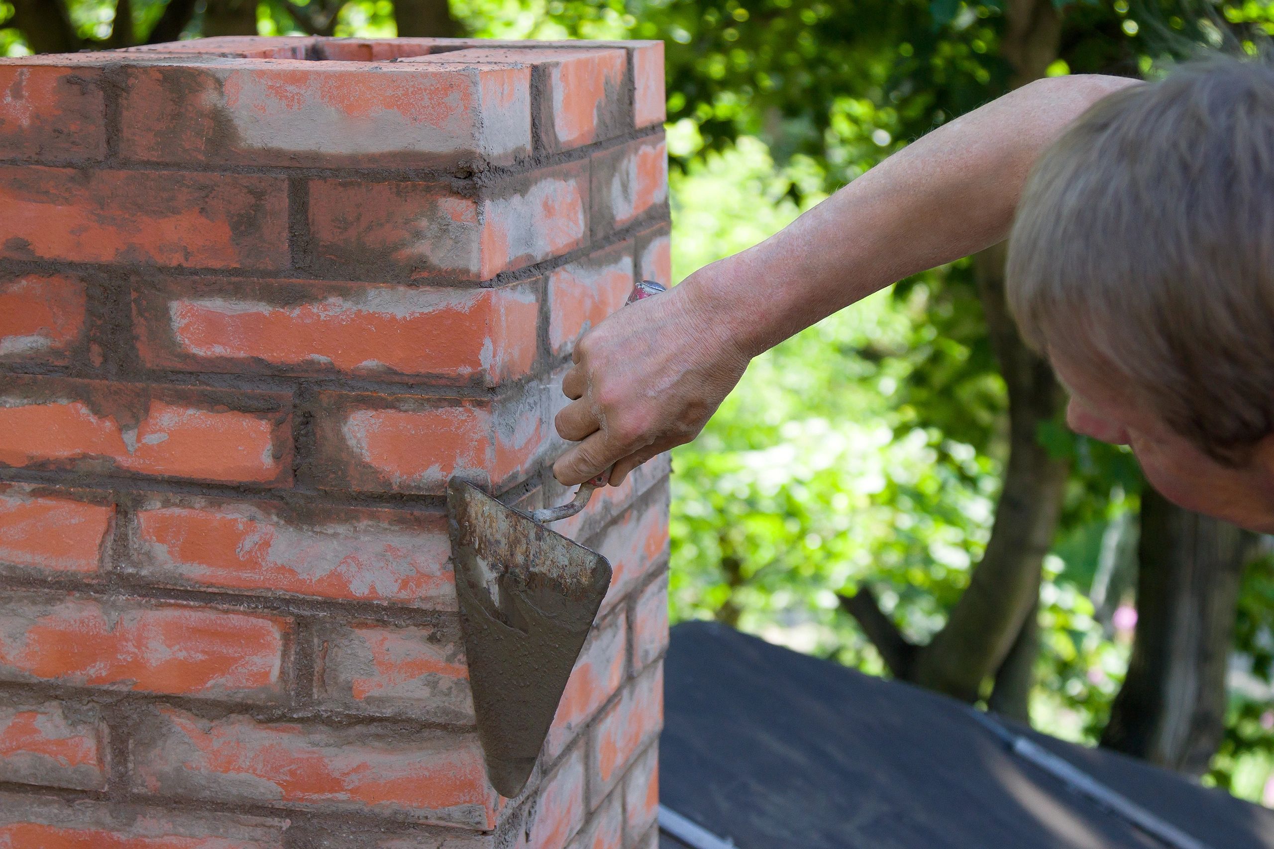 A man making masonry works, working with a