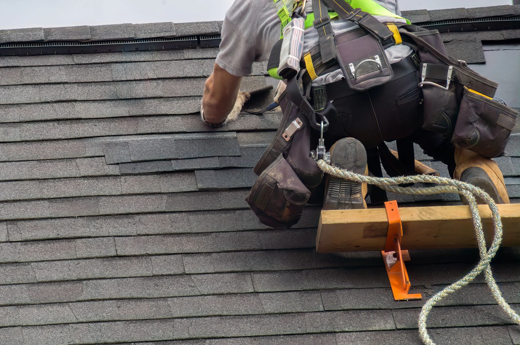 Professional repair construction worker man roofer working on